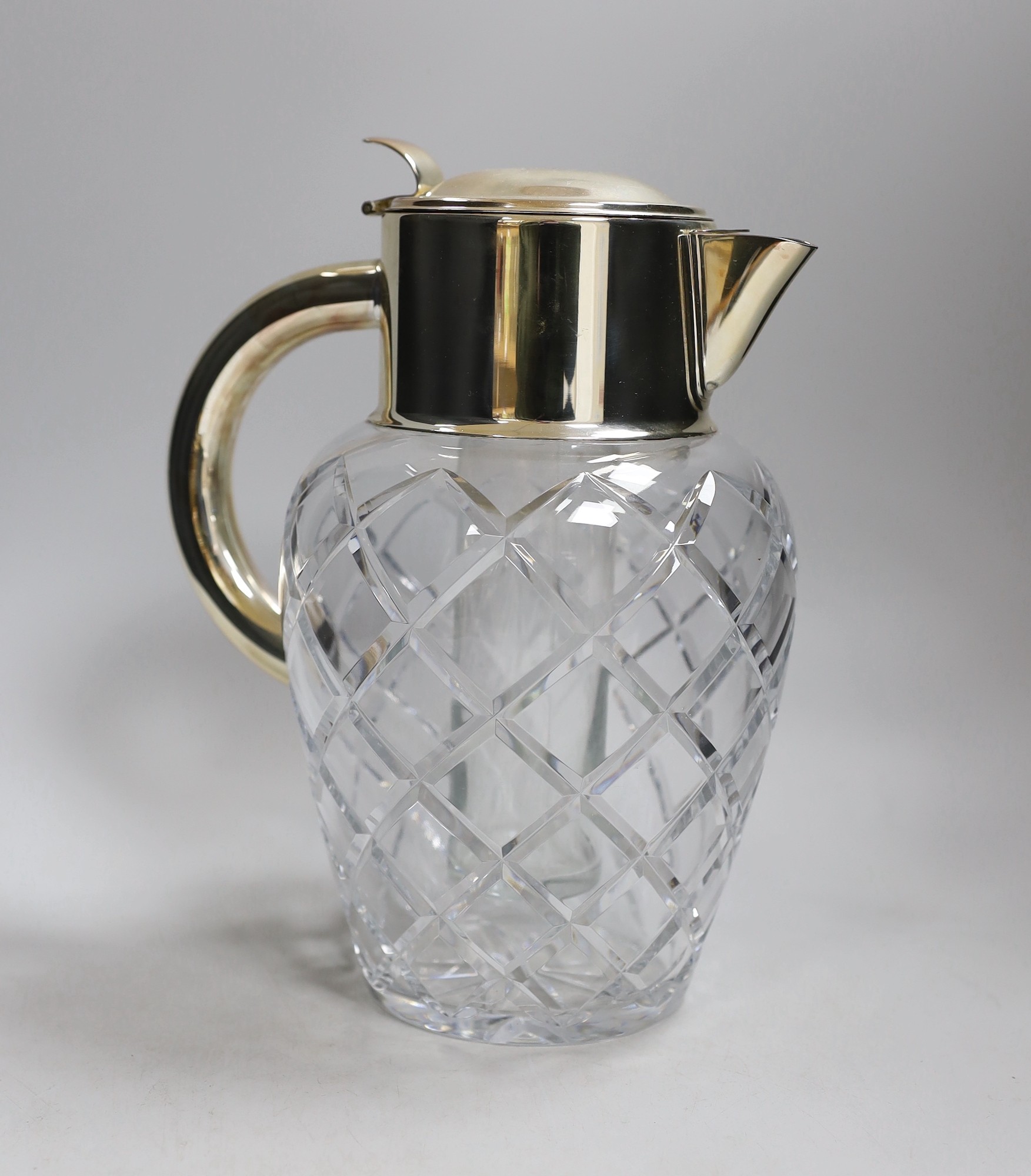 A large cut glass and silver plated jug, possibly for Pimms. 28cm tall